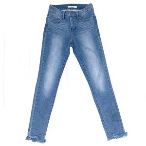 Levi’s light wash jeans with frayed ankles